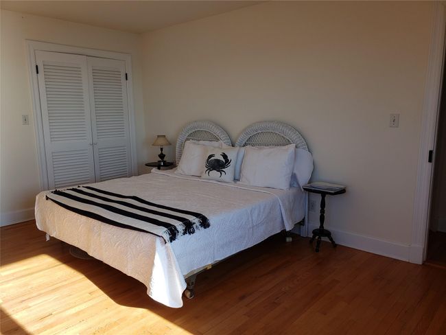 spacious light filled corner guest room has waterview from 2 sides | Image 34