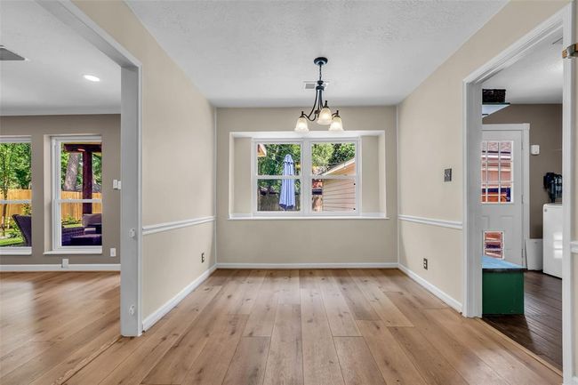 This view of the breakfast room shows convenient access to both the living room and laundry room. | Image 15