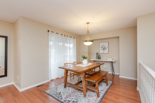 Dining area with access to the balcony overlooking the front yard. | Image 7