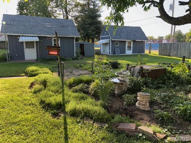 View of yard featuring an outbuilding | Image 8