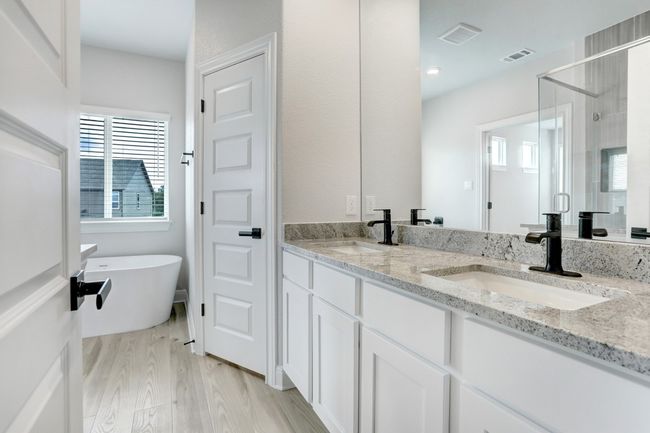 Spa-like soaking tub and separate shower in the master bathroom | Image 5