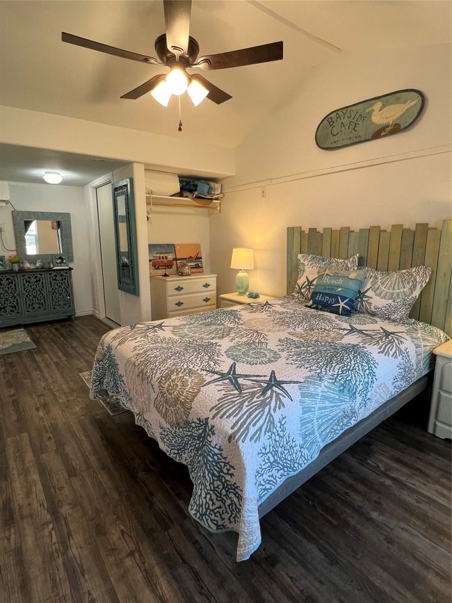 Bedroom featuring lofted ceiling, ceiling fan, and wood finished floors | Image 23
