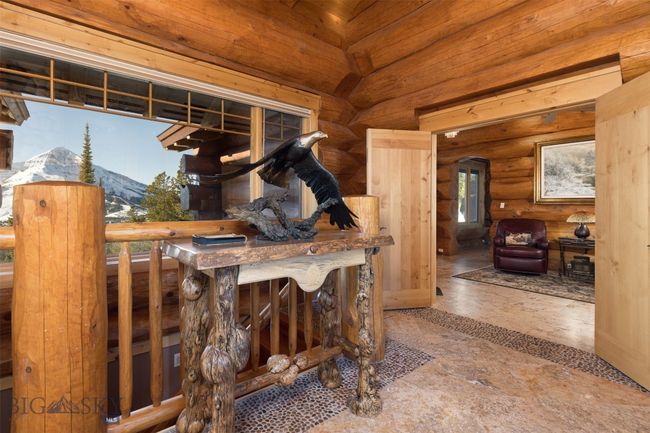 Main level entryway with Lone Mountain view and double door entrance to Primary Suite. | Image 10
