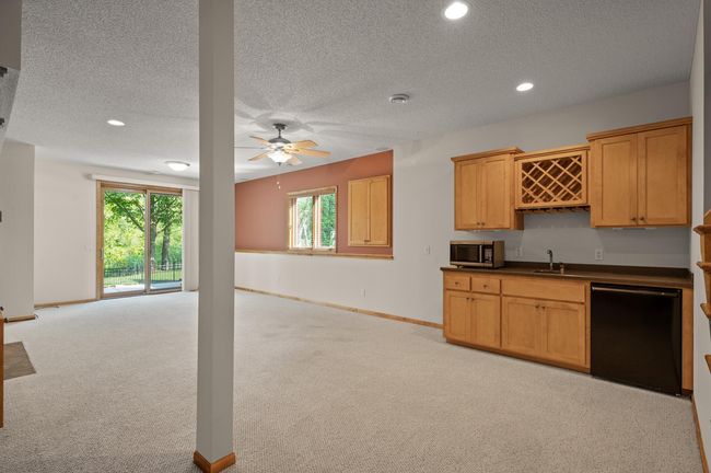 Lovely, custom built wet bar with microwave and beverage frig. | Image 16