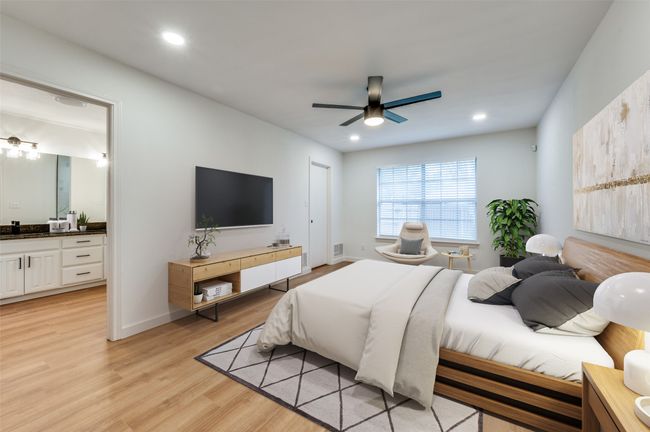 Bedroom featuring recessed lighting, light wood finished floors, ensuite bathroom, and a ceiling fan | Image 18