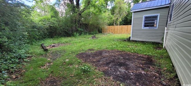 View of yard featuring fence | Image 13