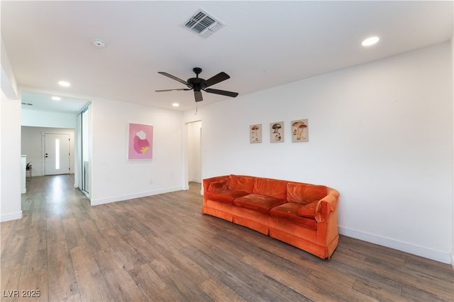 Sitting room featuring visible vents, wood finished floors, ceiling fan, and recessed lighting | Image 9