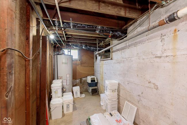 below grade area featuring water heater | Image 27