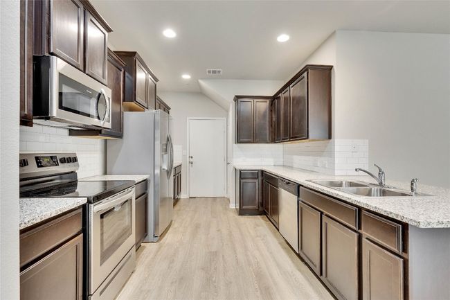 Walk from your 2 car garage directly into your kitchen | Image 4