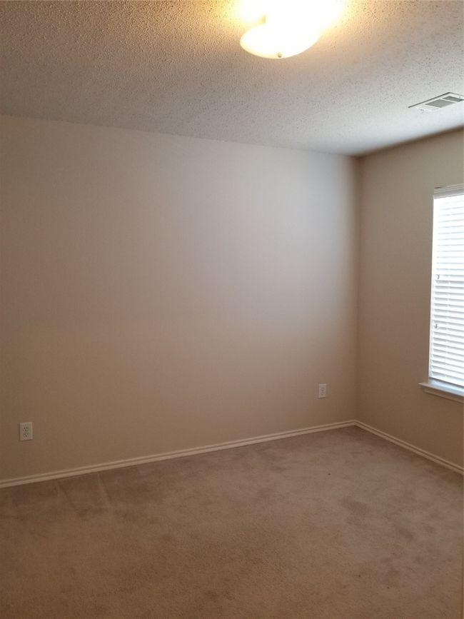 Empty room featuring carpet floors and a textured ceiling | Image 5