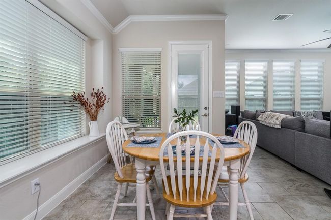 Breakfast nook area with bench seating and tons of natural light. | Image 22