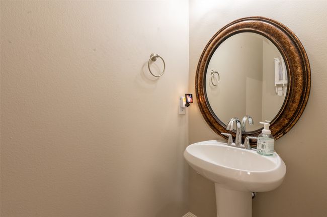 Convenient powder bath off kitchen and living area. | Image 11
