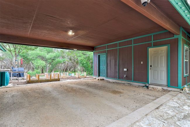 Oversized car port with enclosed storage room and full bathroom | Image 6