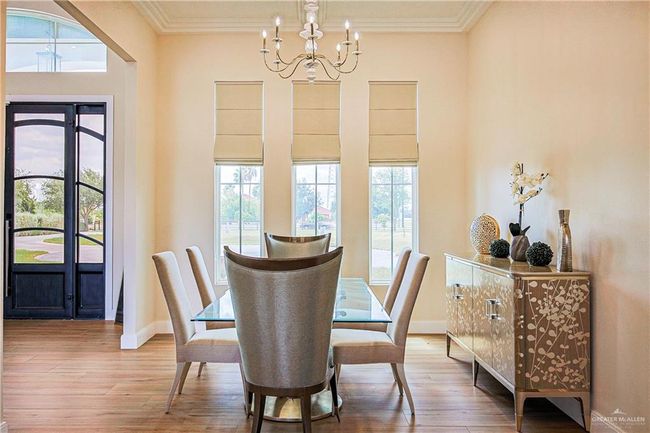 Dining area featuring a chandelier, porcelain floors, plenty of natural light | Image 24