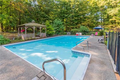 View of swimming pool with a gazebo | Image 2