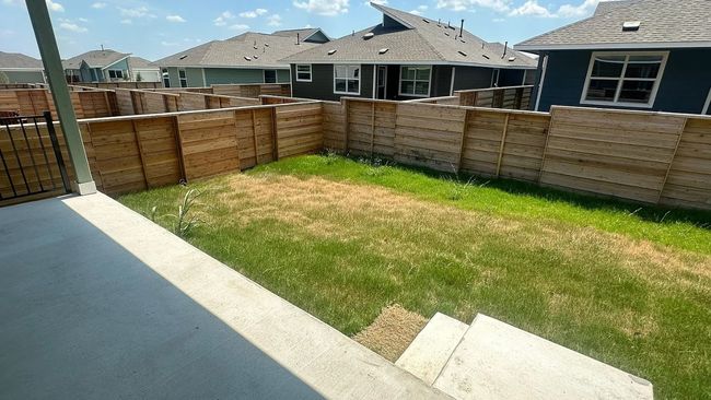 Fenced backyard featuring a residential view | Image 36