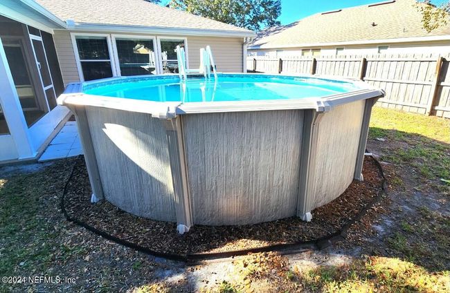 11775 Blueberry Ln, House other with 3 bedrooms, 2 bathrooms and null parking in MACCLENNY FL | Image 48