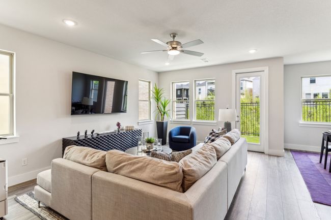 Living area with ceiling fan, wood finished floors, and recessed lighting | Image 36