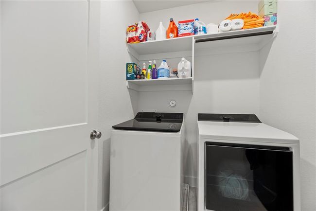 Utility room is upstairs. | Image 19