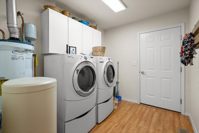 Like new front loading washer and dryer included in sale. | Image 14