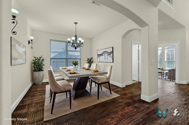 Elegant formal dining room designed for entertaining loved ones. | Image 6