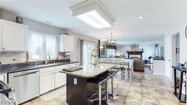 KITCHEN VIEW 3 WITH SIGHT-LINES OF THE DINETTE AND THE LIVING ROOM. | Image 11