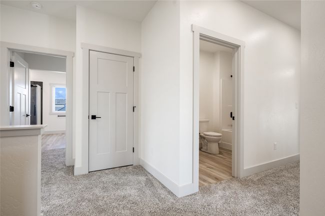 Hall featuring carpet and baseboards | Image 42