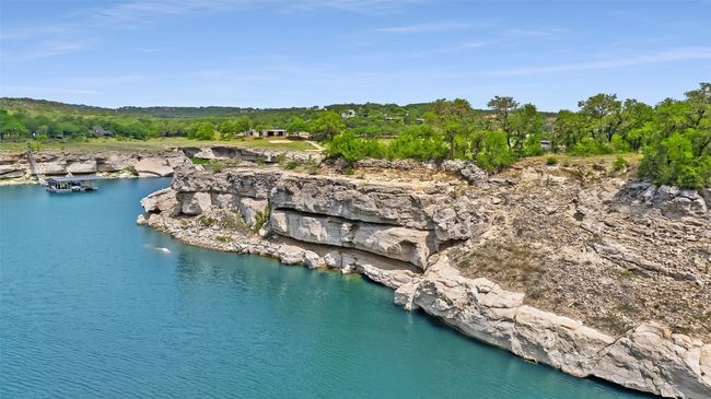 Aerial overview of property's location with a nearby body of water | Image 11