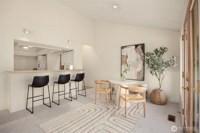 The breakfast eating area also offers additional seating at the kitchen counter. | Image 23