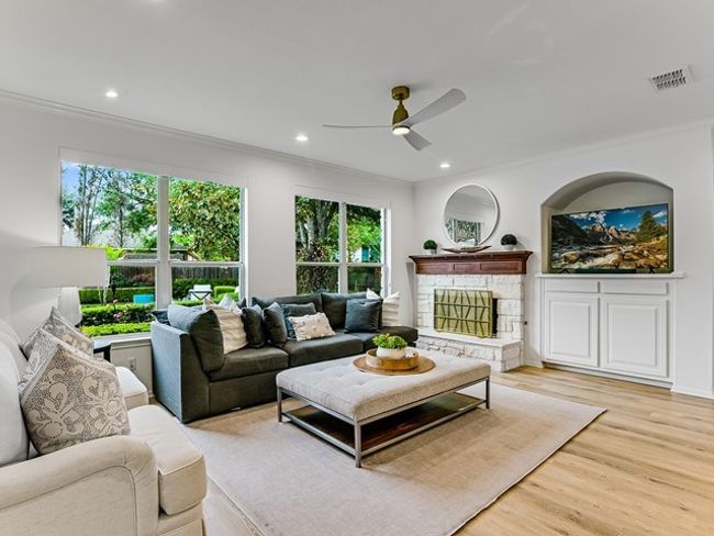 Living room with a ceiling fan, light wood-type flooring, visible vents, ornamental molding, and recessed lighting | Image 7