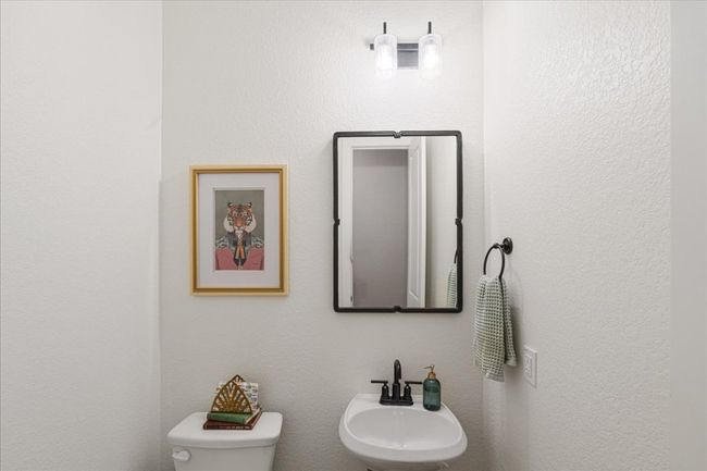 Half bath with a sink and toilet | Image 8
