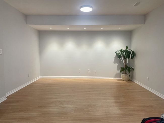 Spare room with light wood-type flooring, baseboards, and recessed lighting | Image 35