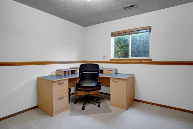 Office featuring light colored carpet, baseboards, and a textured ceiling | Image 28