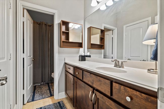 Bathroom featuring vanity, tile patterned flooring, and toilet | Image 31