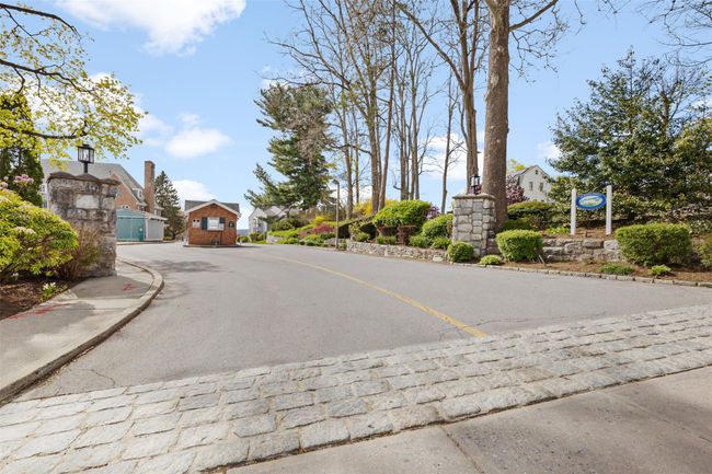 View of road with sidewalks, curbs, and street lights | Image 18