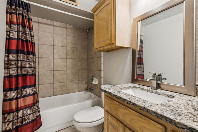 Bathroom with shower / bath combo with shower curtain and vanity | Image 18