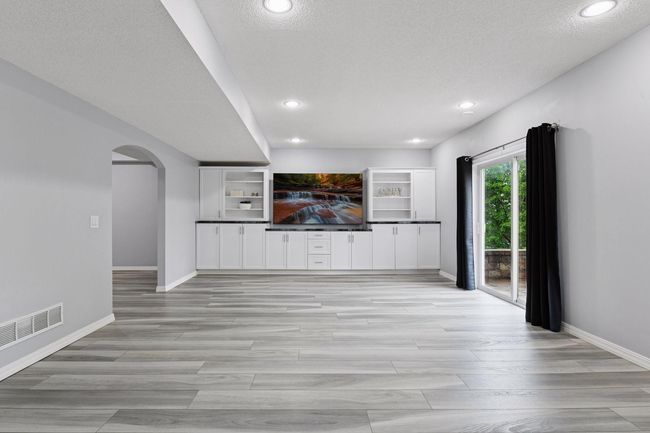 Built in cabinetry and shelving perfect for hosting or entertaining | Image 21