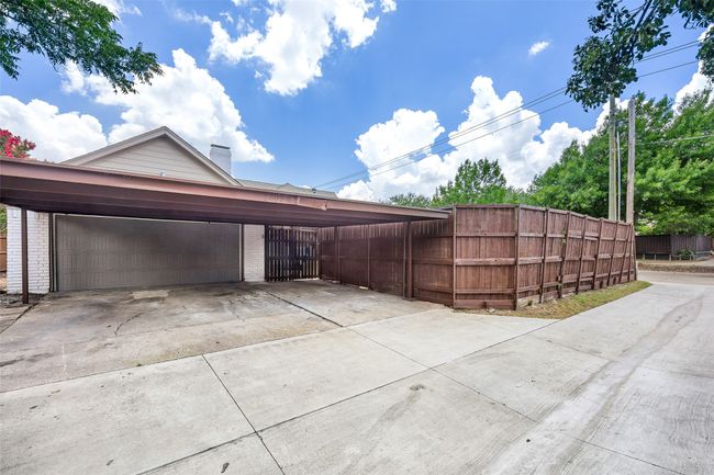 Garage with driveway and a carport | Image 19