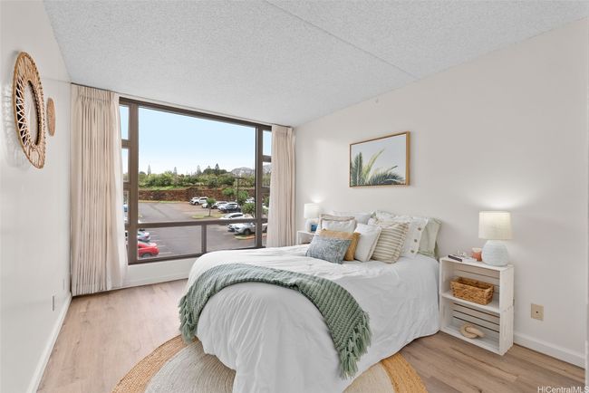 The primary bedroom offers lots of natural light. | Image 11