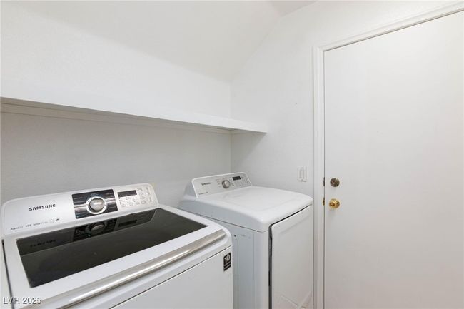 Laundry room featuring separate washer and dryer and laundry area | Image 40