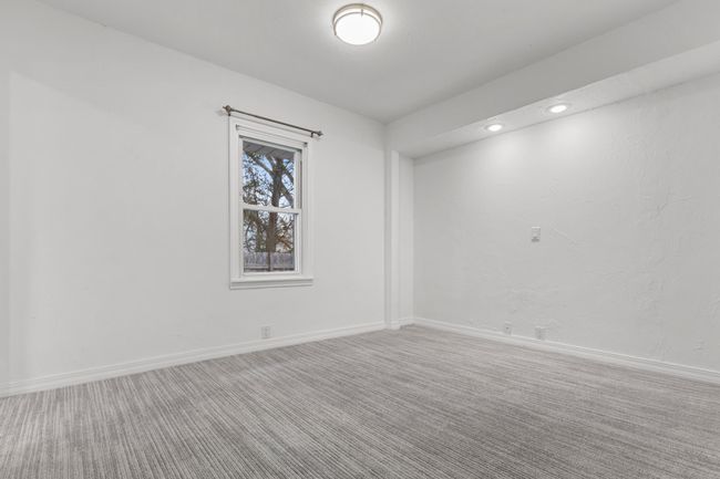 Main level owner's suite features a walk-in closet and private Full Bathroom | Image 15