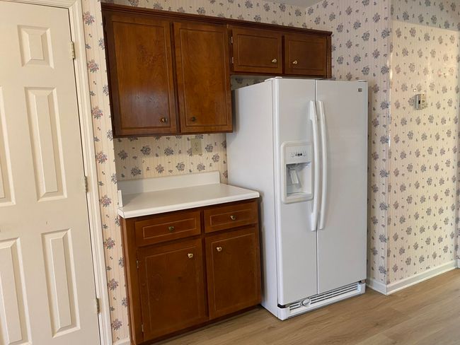 Coffee area beside refrigerator | Image 11