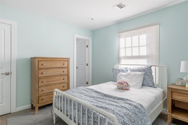 Bedroom featuring wood finished floors and visible vents | Image 44