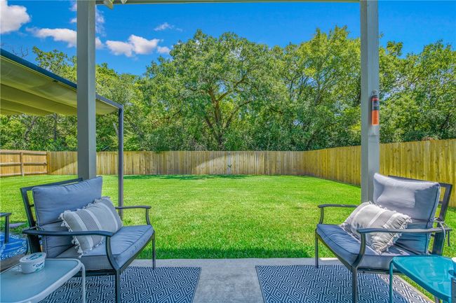 Fenced backyard featuring a patio | Image 26