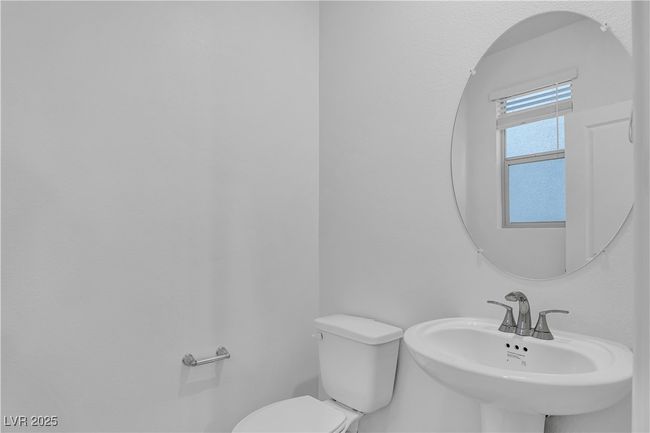 Half bath featuring toilet and a sink | Image 11