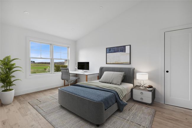 Bedroom with high vaulted ceiling, baseboards, and wood finished floors | Image 18