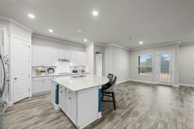 Ample cabinetry and a walk-in pantry ensure there is plenty of storage for cookware and groceries. | Image 13