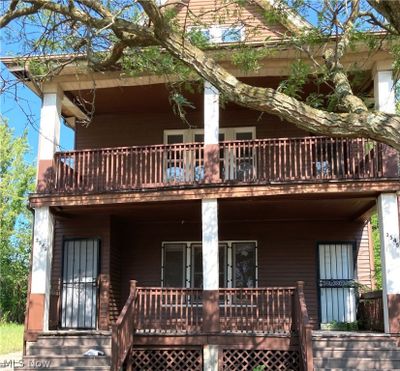 View of front of home with a balcony | Image 2