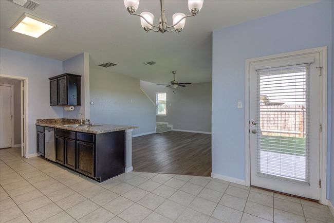 Open floorplan is ideal for entertaining. Rich, espresso colored cabinetry. | Image 11
