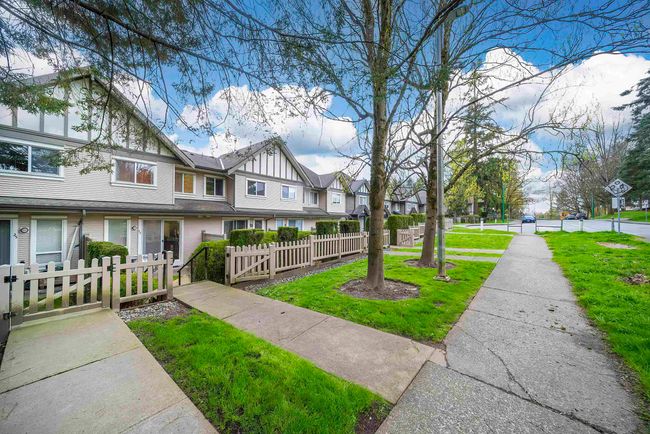 View of property's community featuring a yard, a residential view, a gate, and a fenced front yard | Image 17